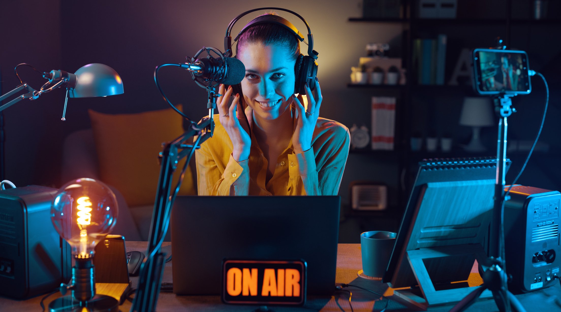 Young radio host broadcasting at the radio station