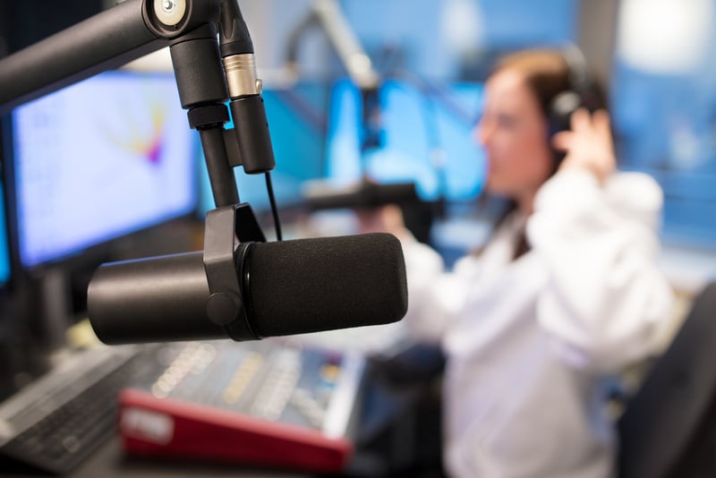 Studio Microphone with a Female Radio Host